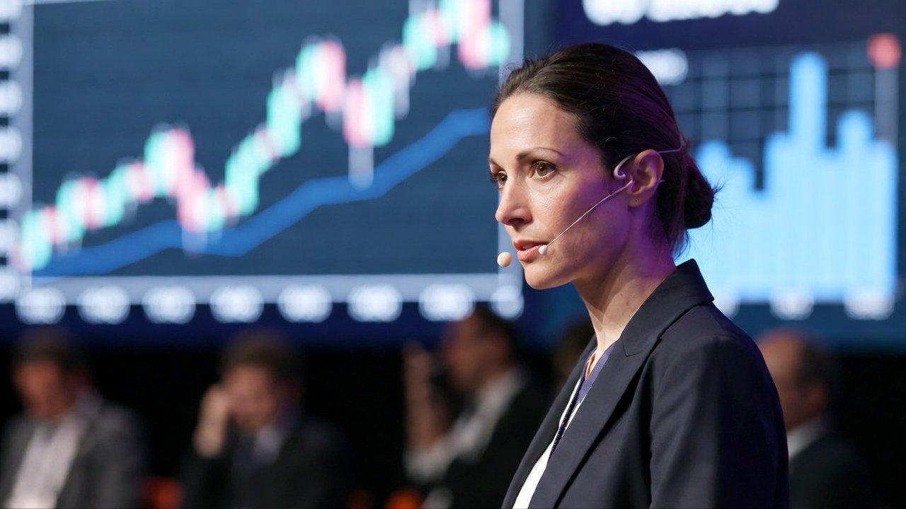 Mujer en una conferencia del sector financiero